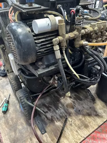 Fuel tank removed from Edge Panther pressure washer to allow cleaning of fuel lines and system during service.